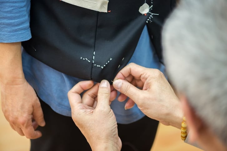 Tailor Pinning, Adjusting and Fitting Hand Tailored Vest for Customer In Hong Kong